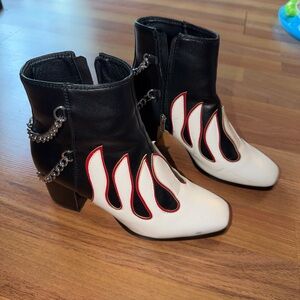 Black leather ankle boots with red accents, featuring a 3" heel and 1" platform